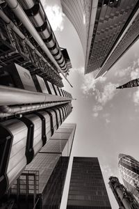 Directly below shot of sky amidst modern buildings