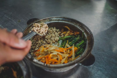 Midsection of person preparing food