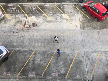 High angle view of people walking on footpath