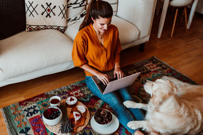 Woman with dog at home