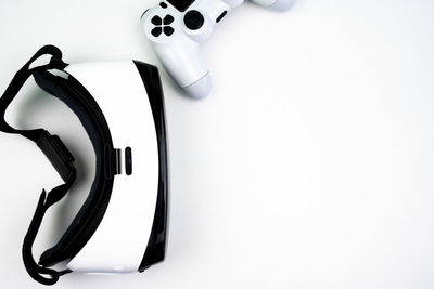 High angle view of camera on table against white background