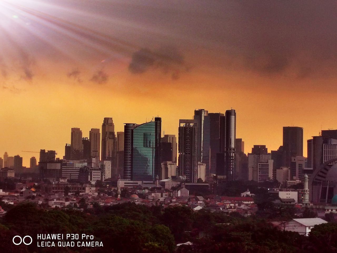 BUILDINGS AGAINST SKY DURING SUNSET