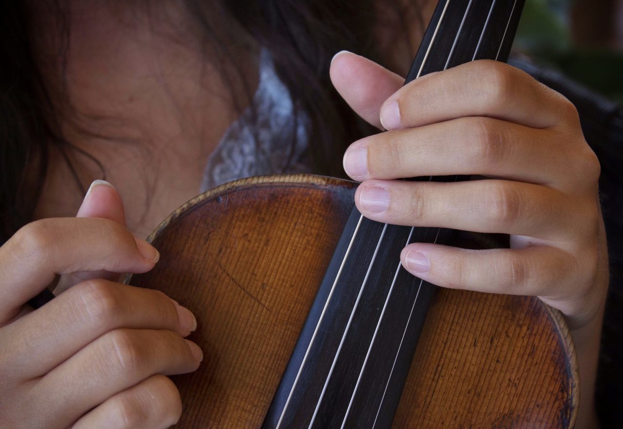 person, part of, indoors, holding, cropped, human finger, close-up, midsection, lifestyles, men, working, focus on foreground, leisure activity, connection, musical instrument, occupation