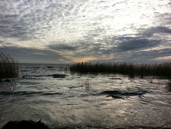 Scenic view of sea against dramatic sky