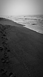 Scenic view of beach against clear sky