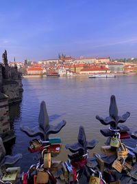 View of boats in river against buildings