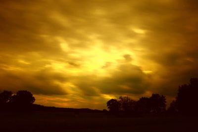 Scenic view of dramatic sky during sunset