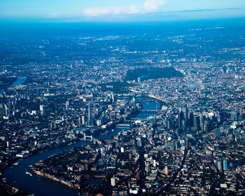 High angle view of illuminated city buildings against sky