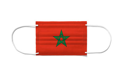 Directly above shot of red flag against white background