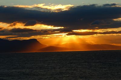 Scenic view of sea against orange sky