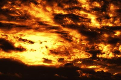 Low angle view of dramatic sky during sunset