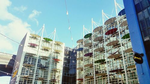 Low angle view of modern buildings against sky