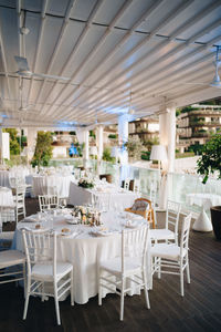 Empty chairs and tables in restaurant