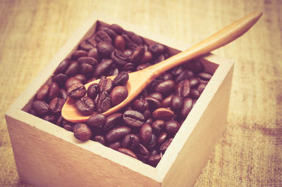 Close-up of roasted coffee beans on table