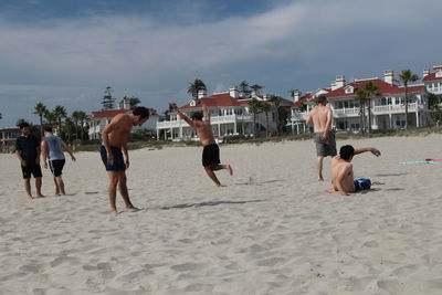 Woman jumping on beach