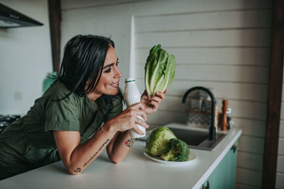 Woman holding food at home