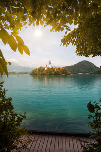 Scenic view of lake against cloudy sky