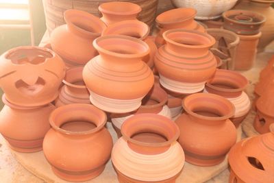 High angle view of various containers for sale at market stall