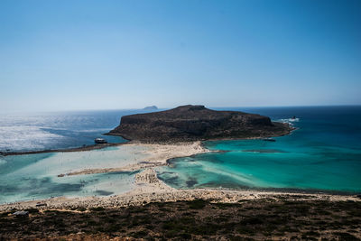 Scenic view of sea against clear blue sky