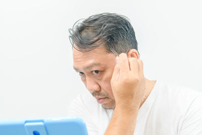 Portrait of a man against white background