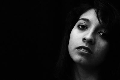 Close-up portrait of a serious young woman