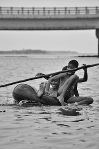 Kids sailing in river 