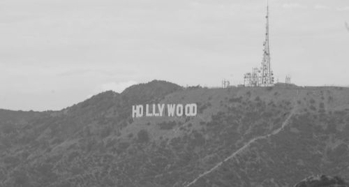 Text on mountain against sky