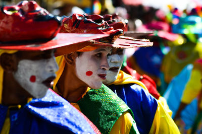 Multi colored umbrellas in traditional clothing