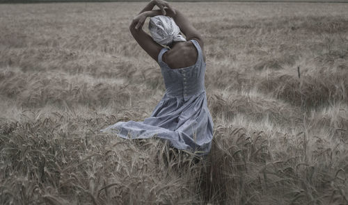 Woman standing in field