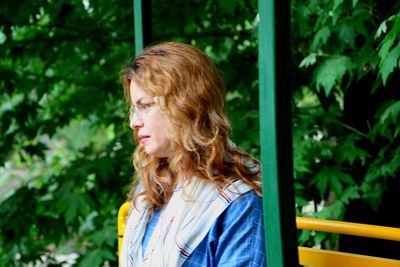 Portrait of young woman standing outdoors