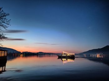 Scenic view of lake against sky at sunset