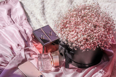 High angle view of pink flowers on bed