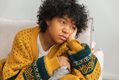 Portrait of young woman looking away