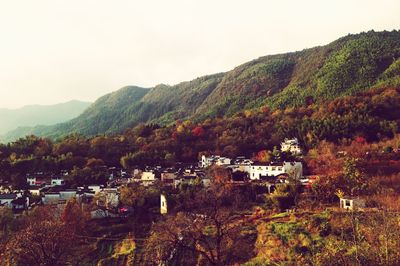 High angle view of trees and mountains against clear sky