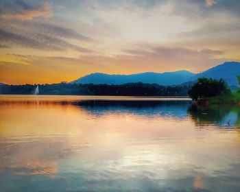 Scenic view of lake against sky during sunset