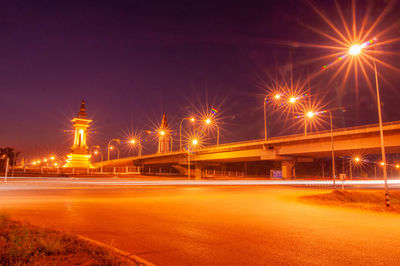 Illuminated light trails on street at night