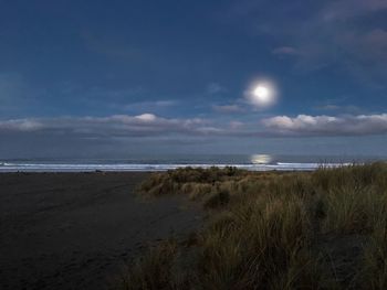 Scenic view of sea against sky at night