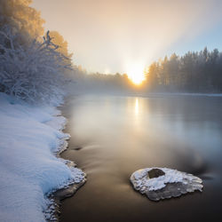 Misty morning by the river in winter