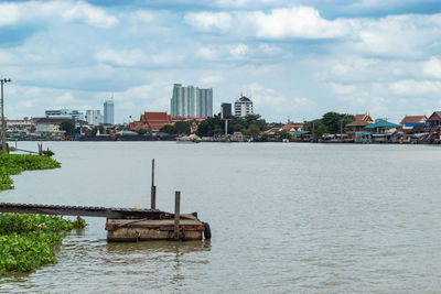 Scenic view of sea and buildings against sky