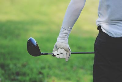 Low section of man playing with ball