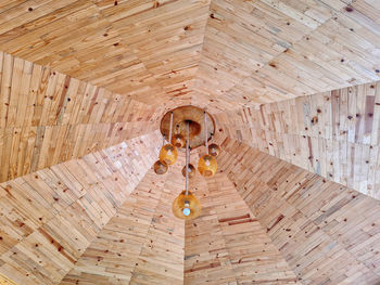 Low angle view of chandelier hanging on ceiling