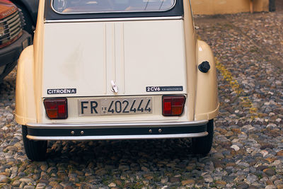 Close-up of vintage car on street