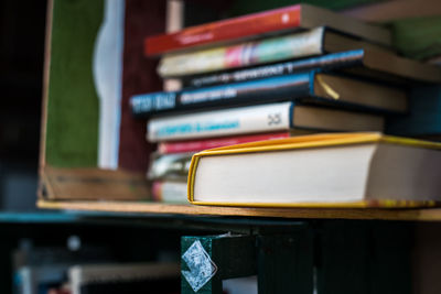 Pile of old books inside wooden boxes for book sharing