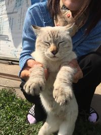 Midsection of woman with cat