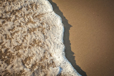 High angle view of surf on beach