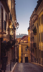 Buildings in town against clear sky