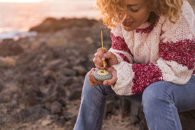 Full length of girl sitting on beach