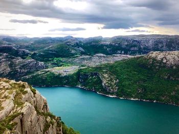 Scenic view of lake and mountains against sky