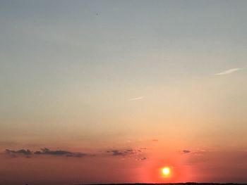 Low angle view of moon at sunset