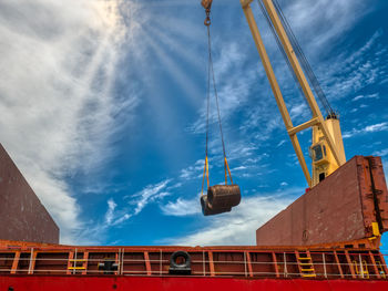 Port operation is discharging steel wire rod from cargo hold of the vessel.